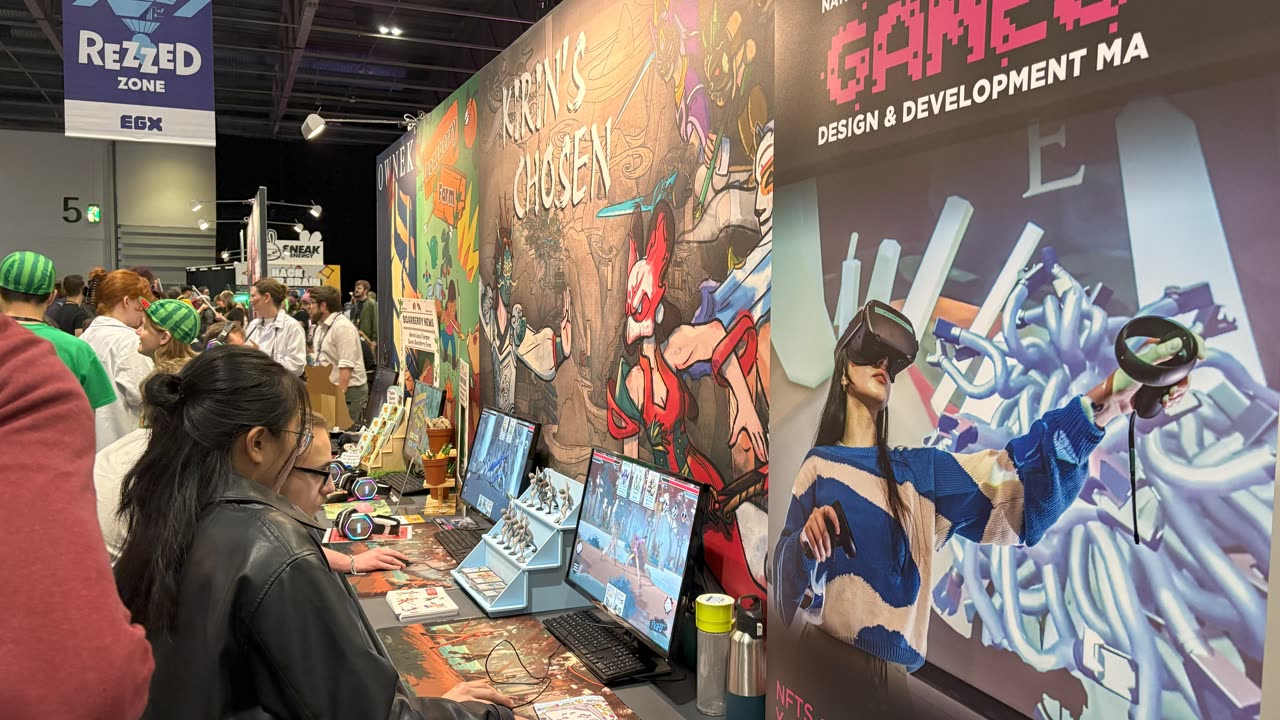 The NFTS Games Design and Development MA stand at EGX Rezzed, with visitors playing students' final year projects.